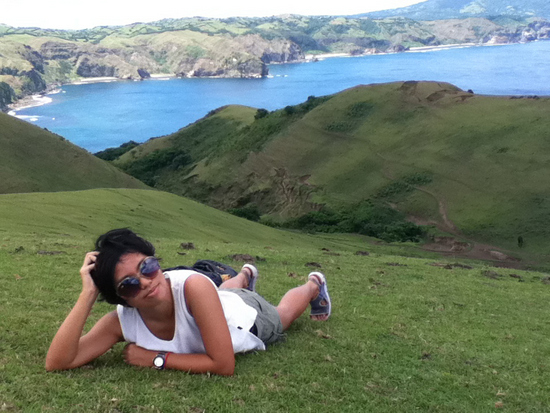 Vira trying to hide her exhaustion after climbing the hill in Batanes, Philippines Vira trying to hide her exhaustion after climbing the hill in Batanes, Philippines