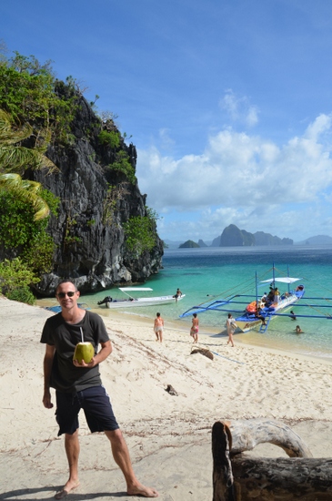 Sipping on a coconut in the Bacuit Archipelago, Philippines