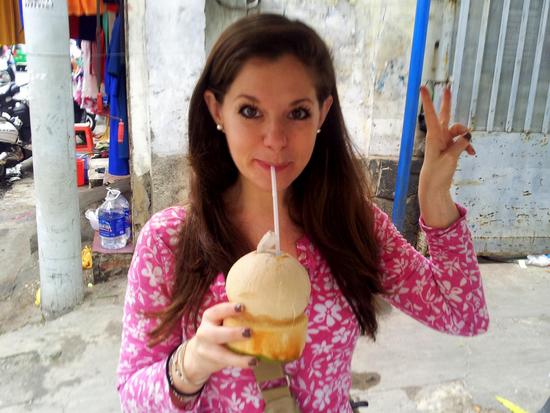 Jodi getting her fill of fresh coconut juice prior to leaving Vietnam
