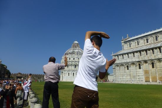 People holding up the leaning tower of Pisa